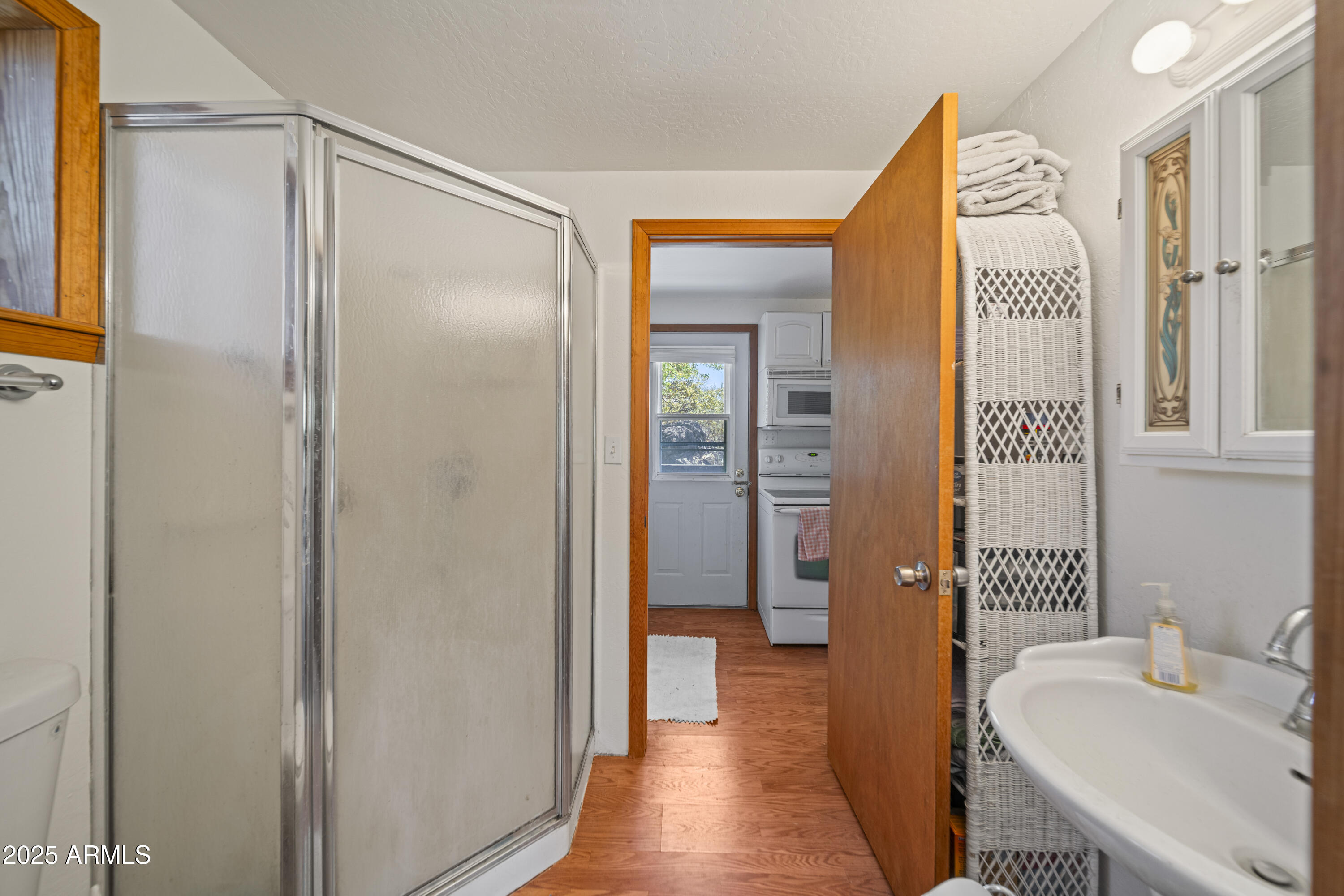 16947 Willow Avenue Yarnell, AZ 85362 - Photo 19 of 44 a en suite bathroom with a shower sink and a mirror