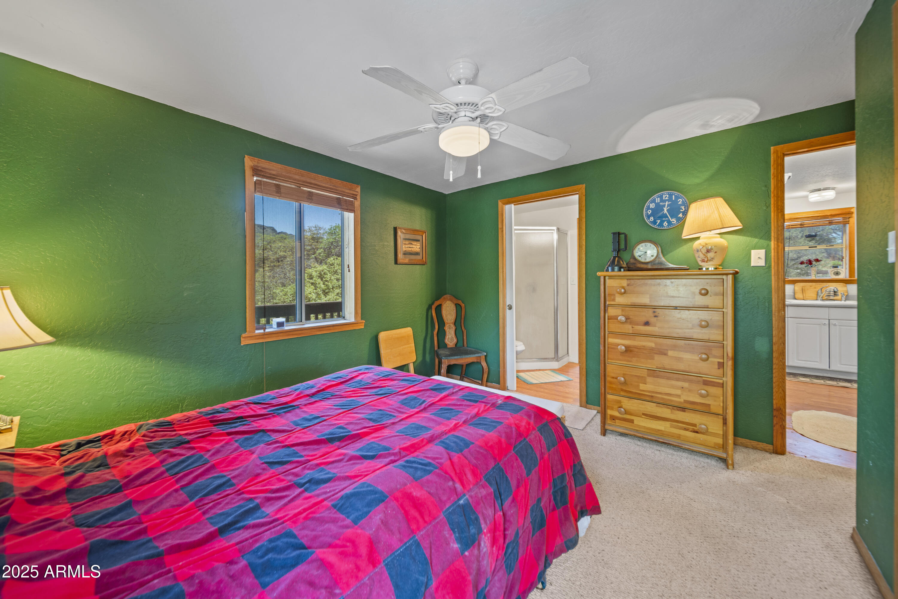 16947 Willow Avenue Yarnell, AZ 85362 - Photo 21 of 44 a bed sitting in a bedroom next to a window