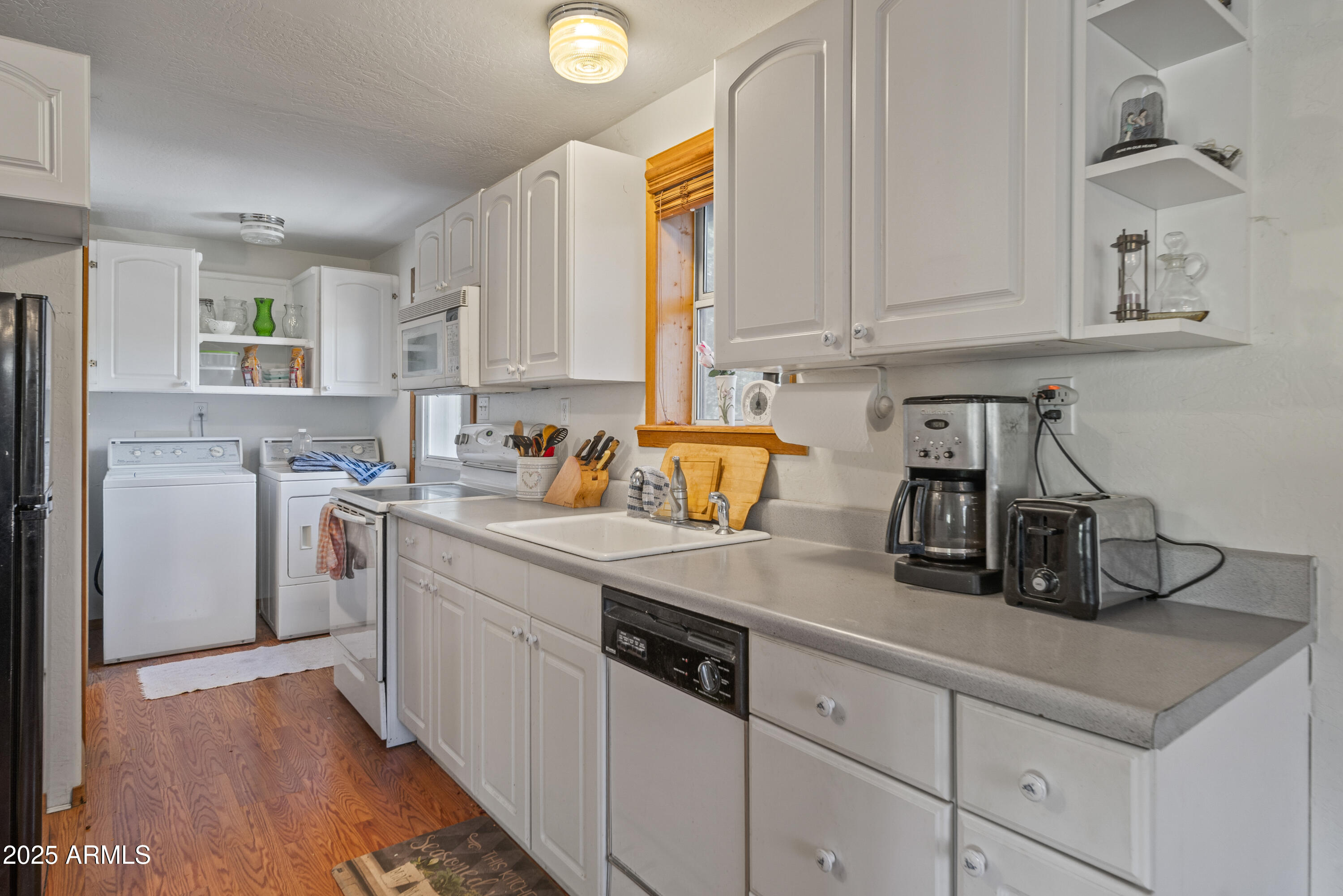 16947 Willow Avenue Yarnell, AZ 85362 - Photo 22 of 44 a kitchen with stainless steel appliances granite countertop a sink stove and cabinets