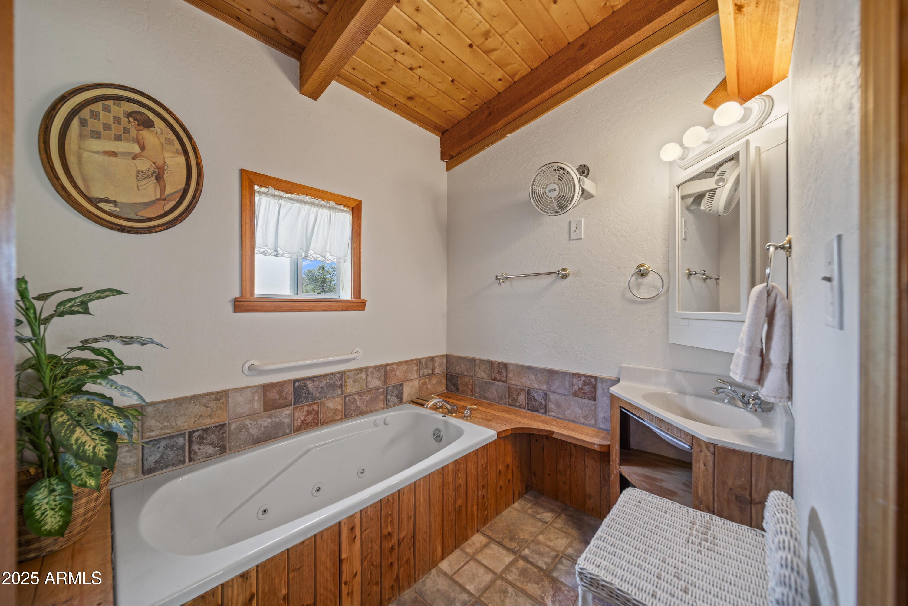 16947 Willow Avenue Yarnell, AZ 85362 - Photo 24 of 44 a bathroom with a tub sink and mirror