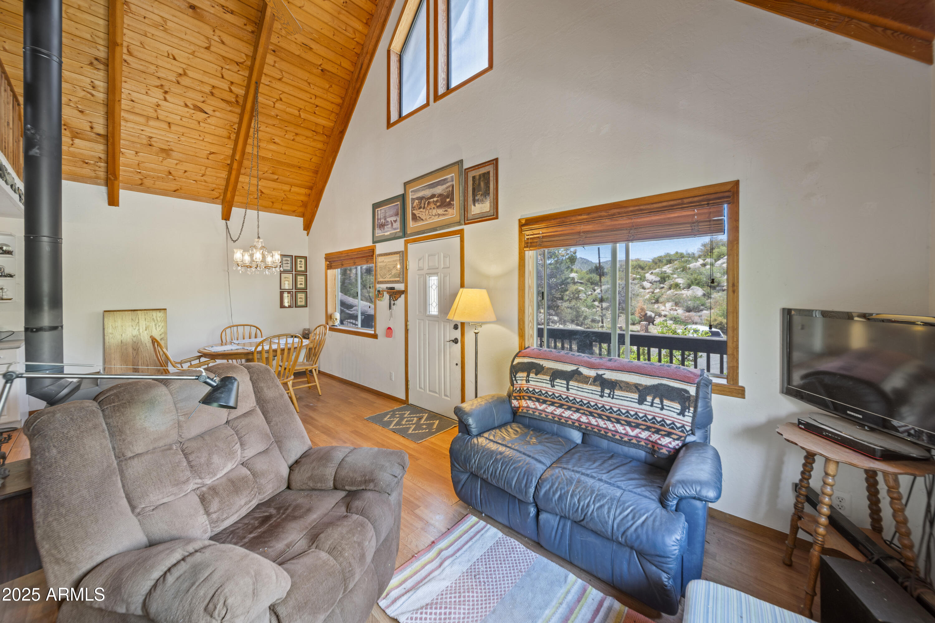 16947 Willow Avenue Yarnell, AZ 85362 - Photo 28 of 44 a living room with furniture a flat screen tv and a window