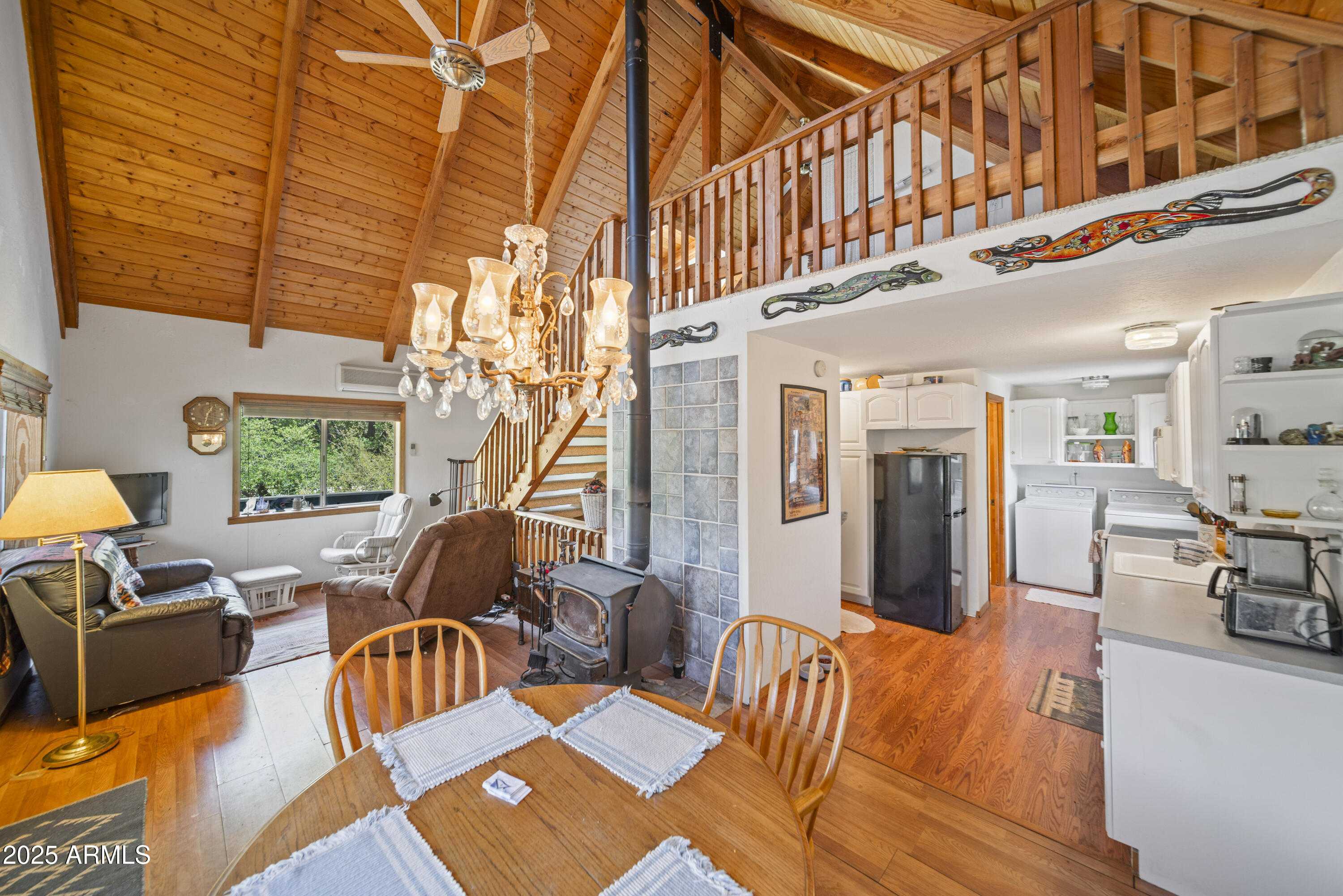 16947 Willow Avenue Yarnell, AZ 85362 - Photo 29 of 44 a living room with furniture a rug and a chandelier