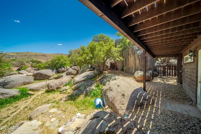 a house that has a tree in front of it