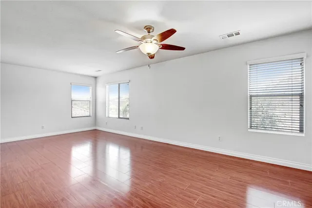 a bathroom with a granite countertop sink a toilet and a tub
