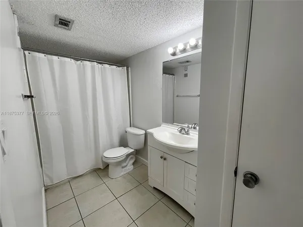 a bathroom with a double vanity sink mirror and