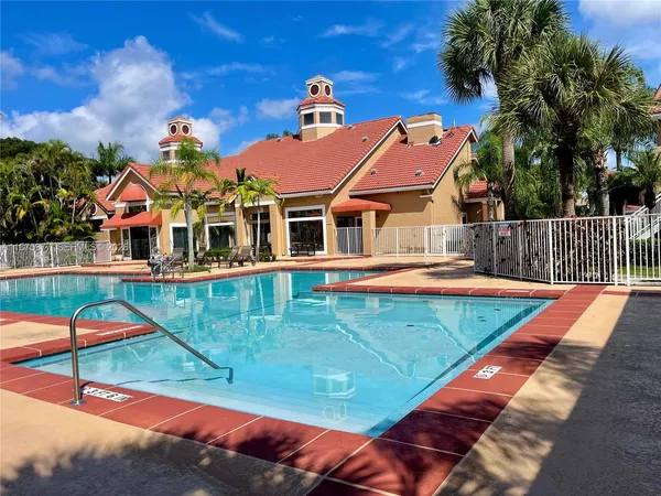 a view of a swimming pool with a patio