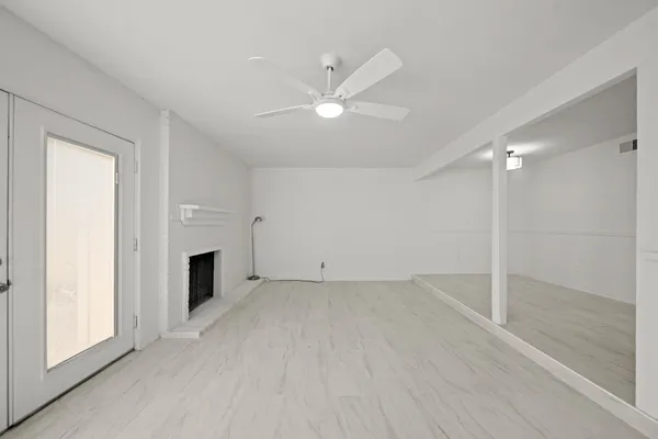 a view of kitchen with refrigerator sink and cabinets