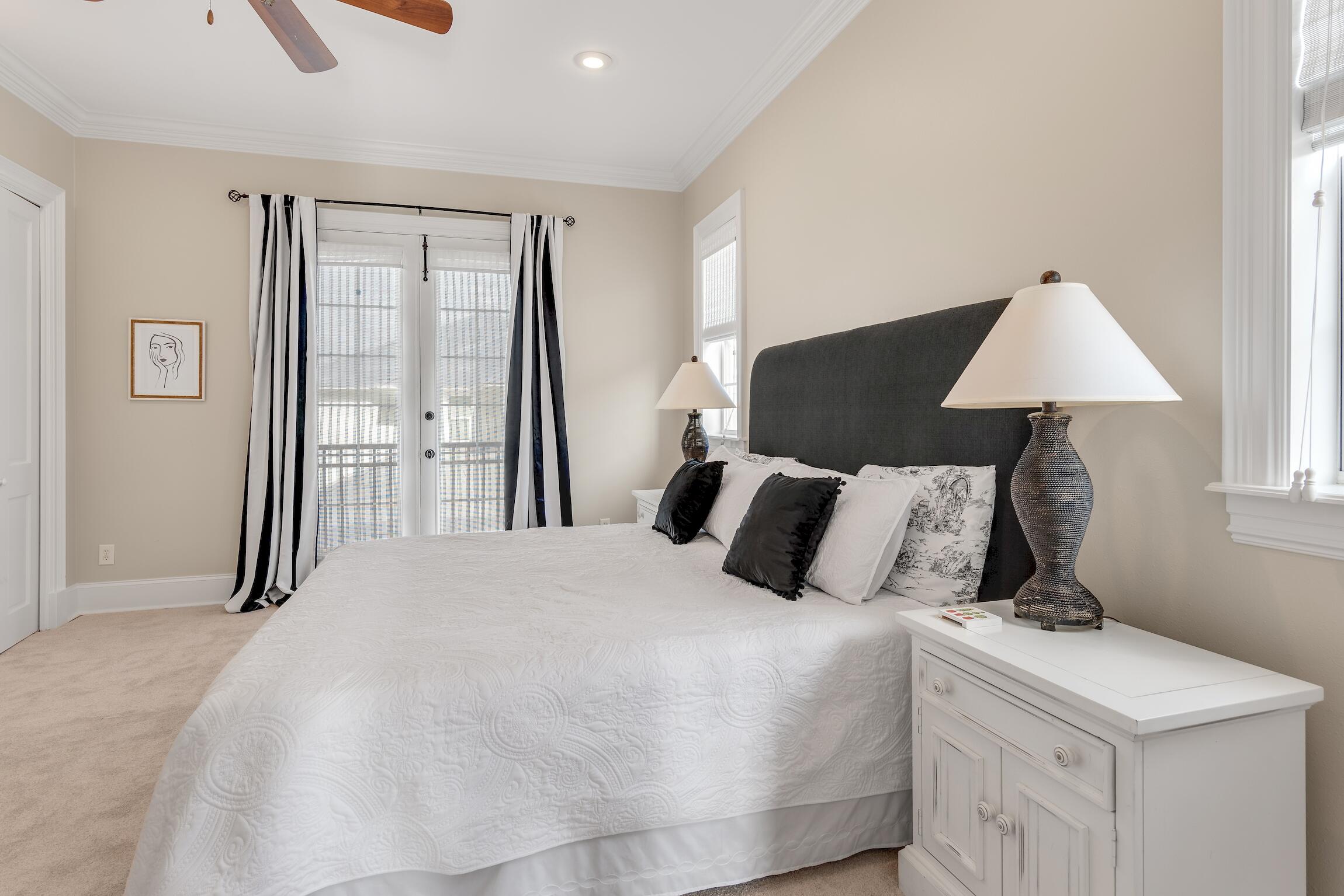 130 Palmeira Way Santa Rosa Beach, FL 32459 - Photo 14 of 38 a bedroom with a bed and a lamp