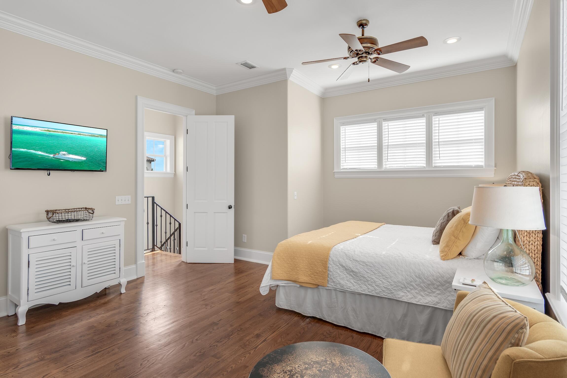 130 Palmeira Way Santa Rosa Beach, FL 32459 - Photo 20 of 38 a bedroom with a bed and a flat screen tv