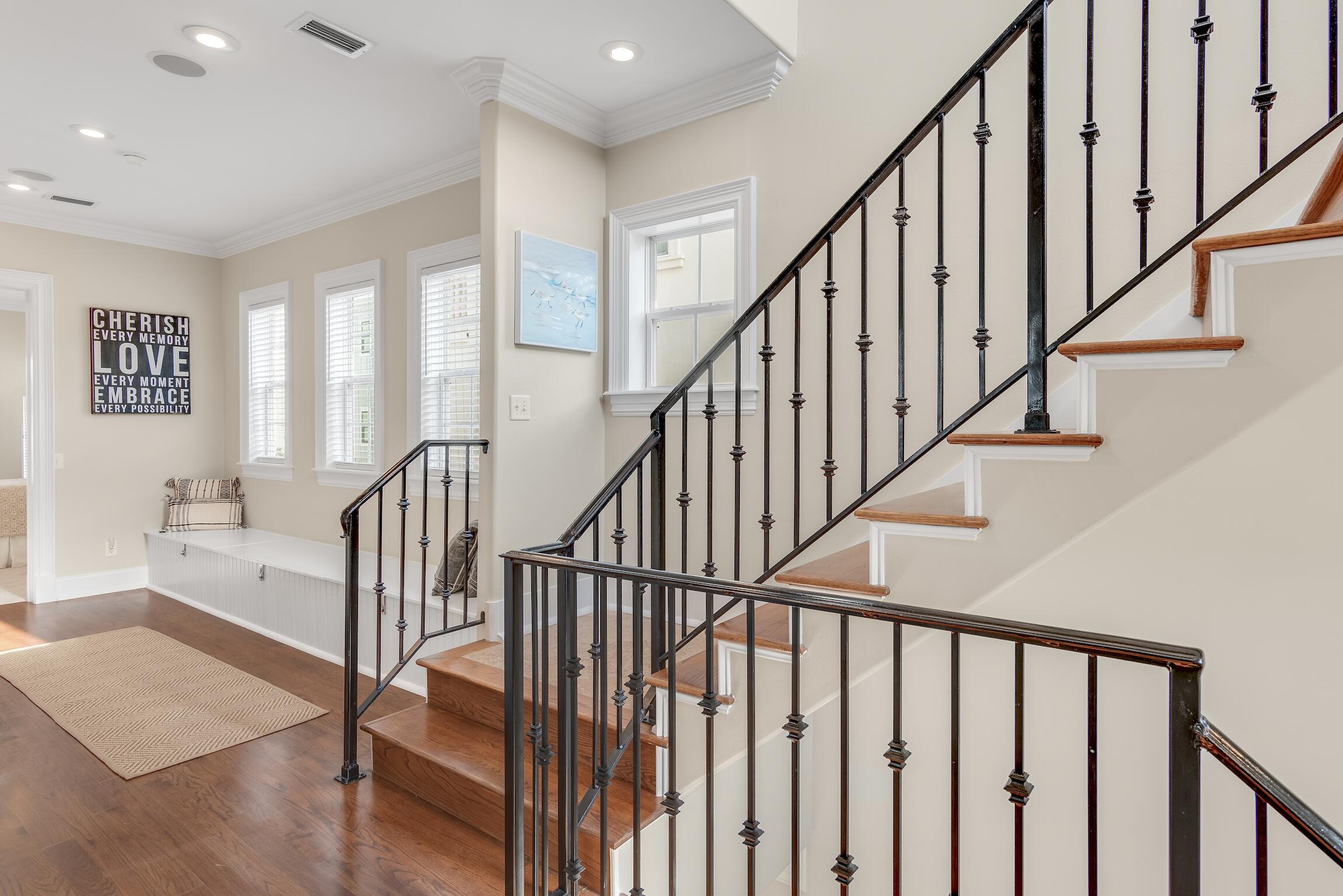 130 Palmeira Way Santa Rosa Beach, FL 32459 - Photo 25 of 38 a view of staircase with wooden floor and a chandelier