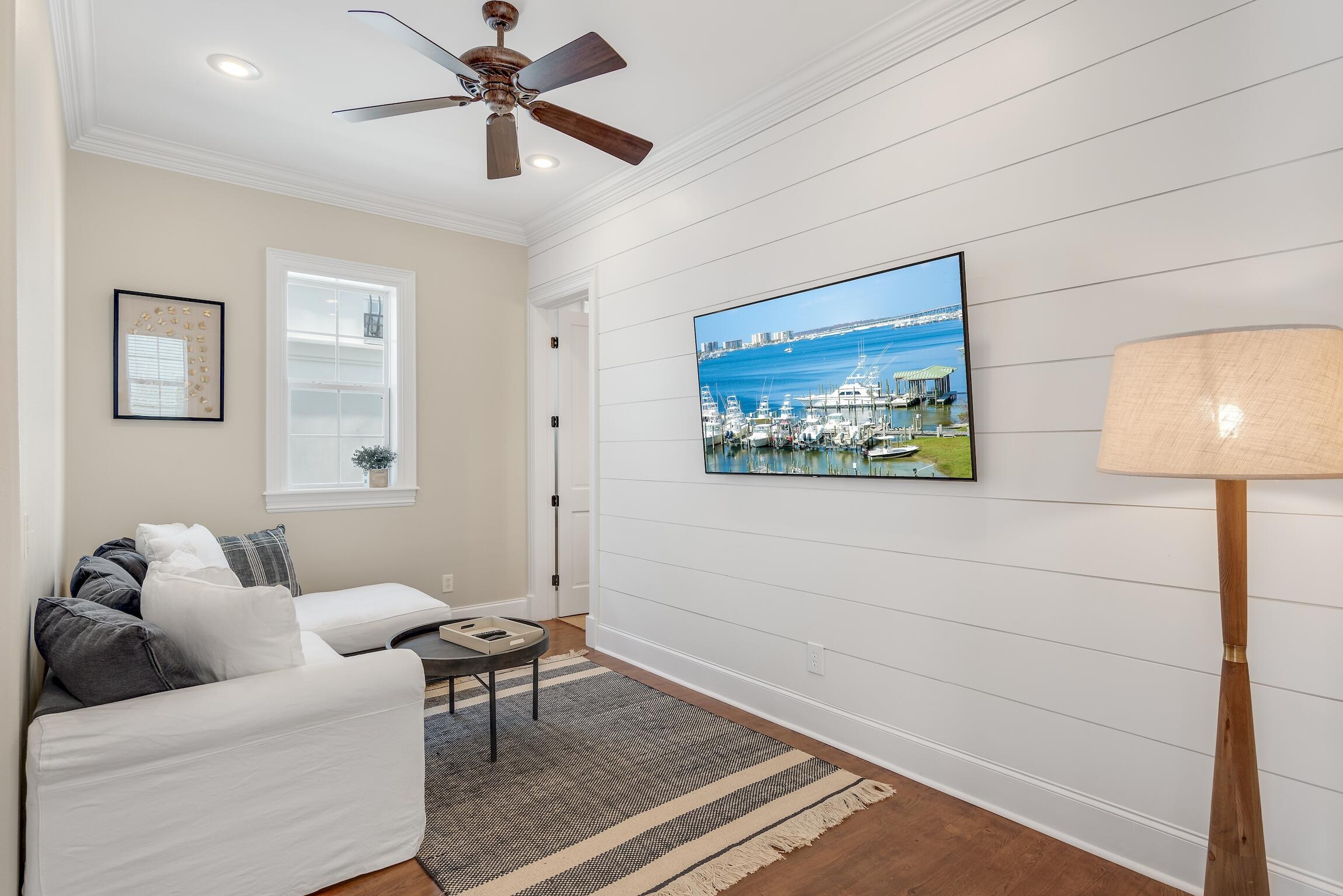 130 Palmeira Way Santa Rosa Beach, FL 32459 - Photo 26 of 38 a living room with furniture and a lamp
