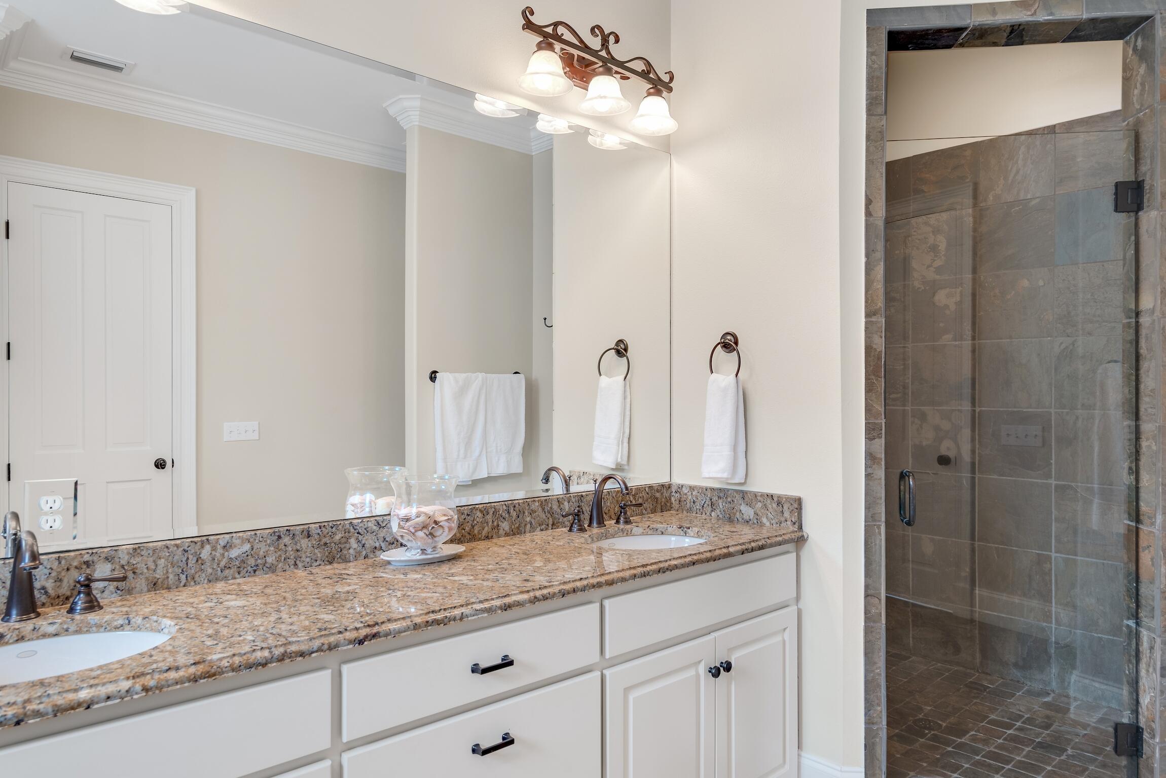 130 Palmeira Way Santa Rosa Beach, FL 32459 - Photo 29 of 38 a bathroom with a granite countertop double vanity sink mirror and shower