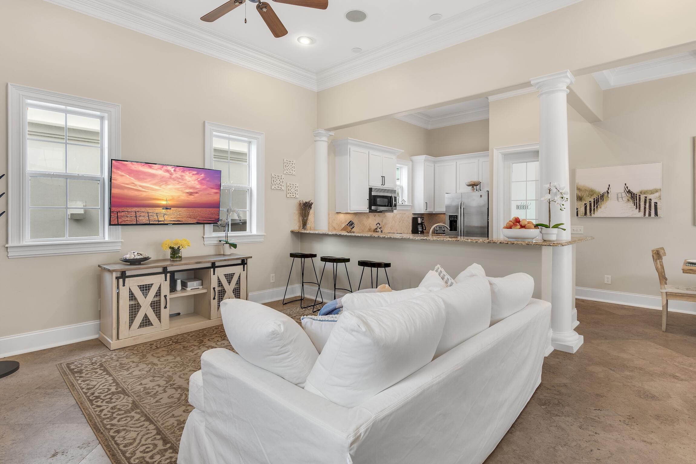 130 Palmeira Way Santa Rosa Beach, FL 32459 - Photo 3 of 38 a living room with furniture and a flat screen tv