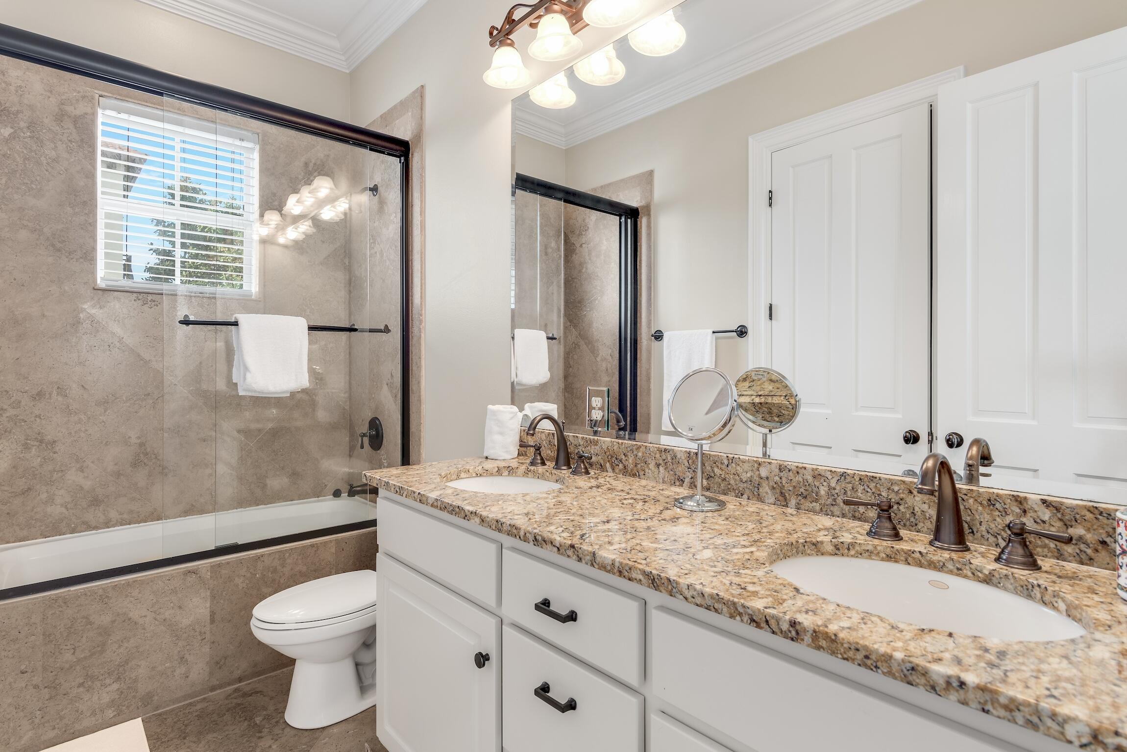 130 Palmeira Way Santa Rosa Beach, FL 32459 - Photo 32 of 38 a bathroom with a granite countertop sink a toilet a mirror and shower