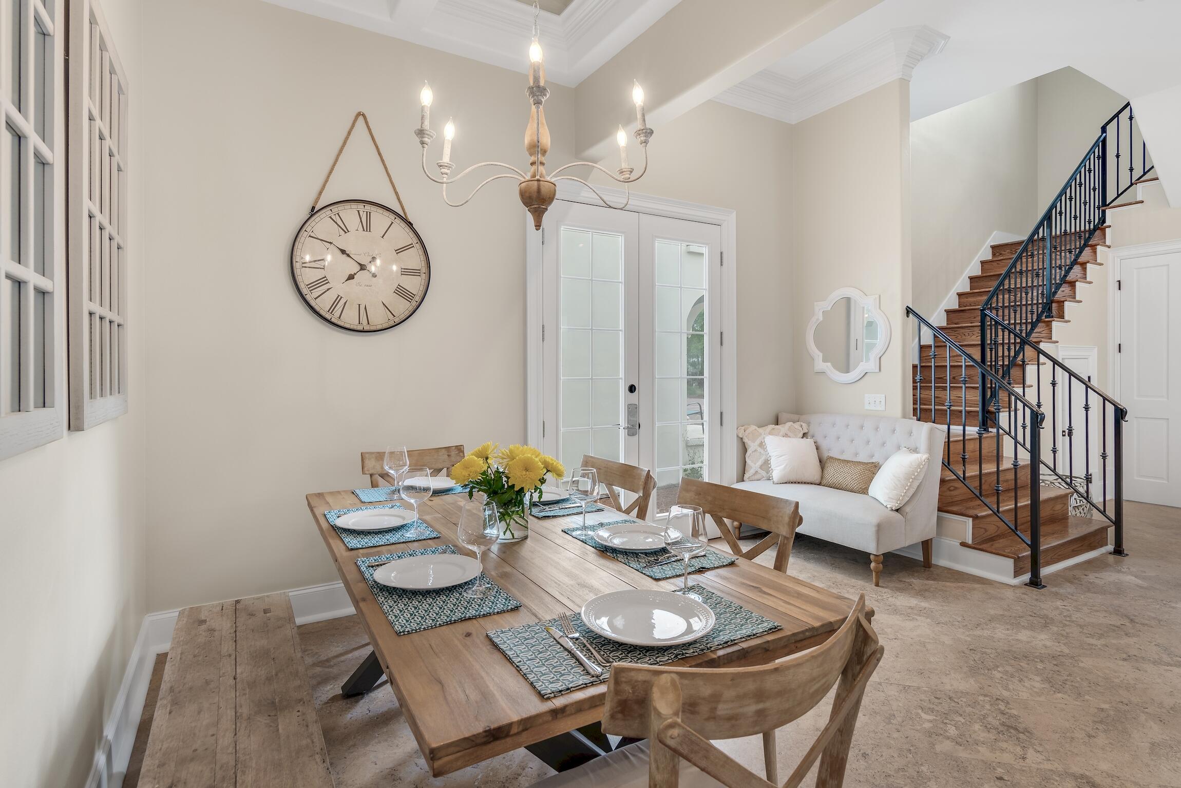130 Palmeira Way Santa Rosa Beach, FL 32459 - Photo 7 of 38 a dining room with furniture a rug and a mirror