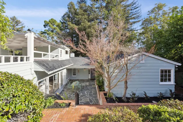 a front view of a house with garden