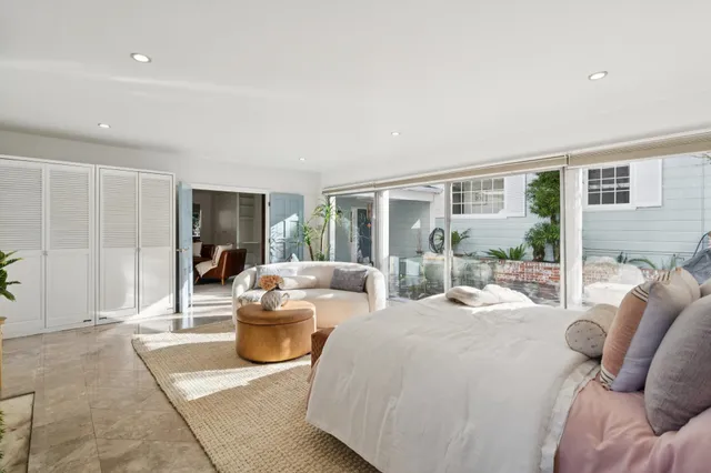 a bathroom with a toilet a sink and a window