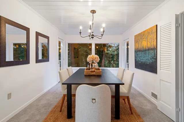 a kitchen with a stove a sink and a refrigerator