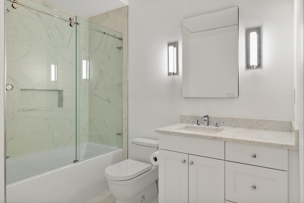 32 Derne Street, Unit 3A Boston, MA 02114 - Photo 16 of 25 a bathroom with a sink toilet and shower