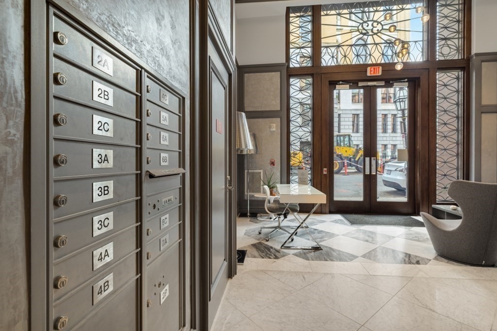 32 Derne Street, Unit 3A Boston, MA 02114 - Photo 22 of 25 a living room with furniture a large window and outdoor space