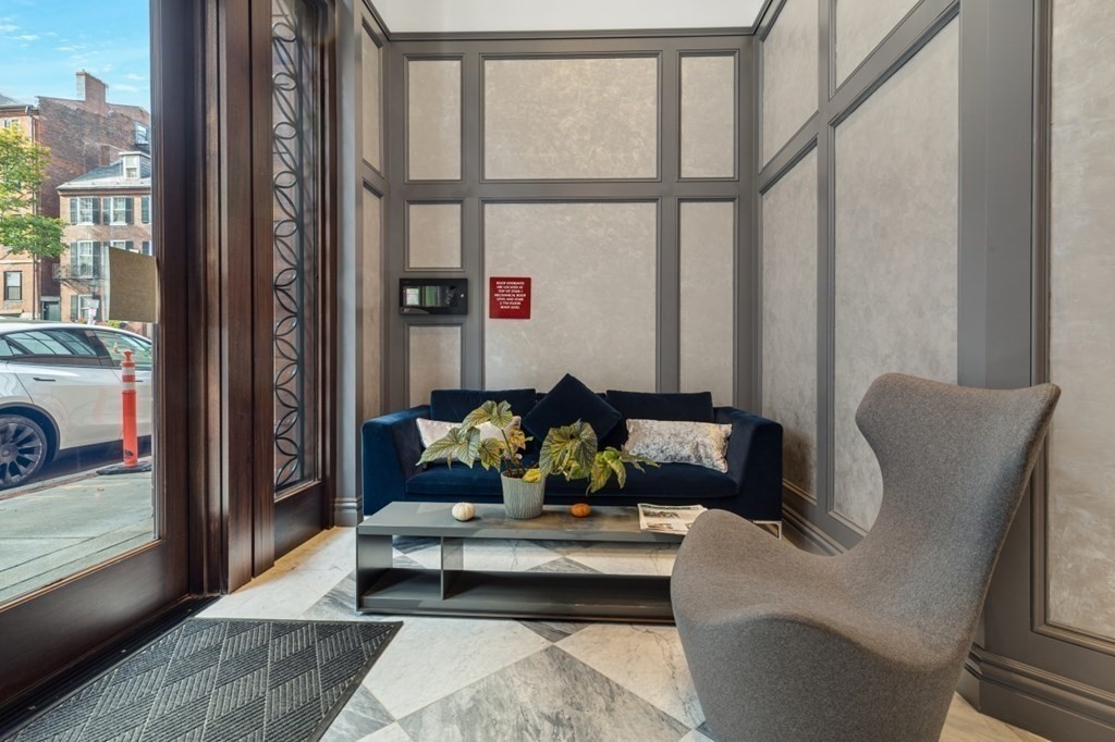 32 Derne Street, Unit 3A Boston, MA 02114 - Photo 23 of 25 a living room with furniture and a window