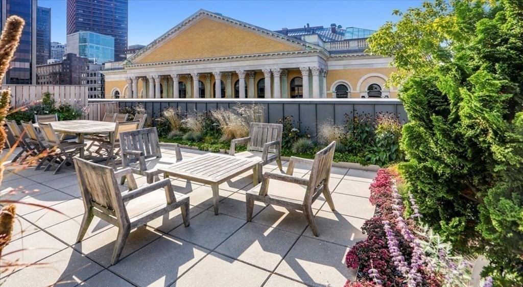 32 Derne Street, Unit 3A Boston, MA 02114 - Photo 24 of 25 a view of house with a yard and sitting area