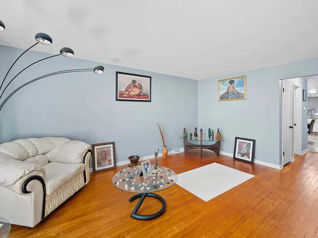 a living room with furniture and next to a window