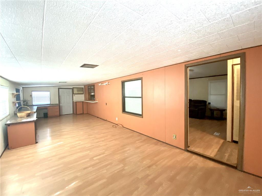 219 Bundle Wagon Drive Mission, TX 78574 - Photo 2 of 30 Unfurnished living room featuring light wood-type flooring