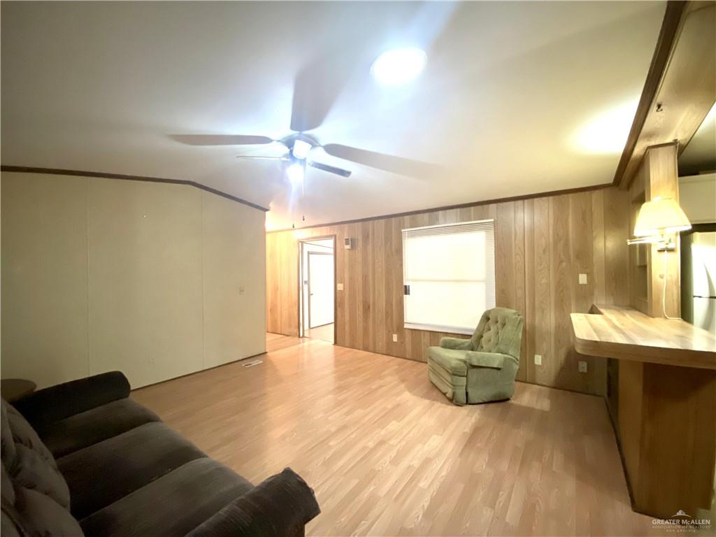 219 Bundle Wagon Drive Mission, TX 78574 - Photo 4 of 30 Living room featuring ceiling fan, wood finished floors, and crown molding