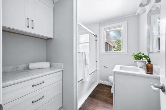 a bathroom with a sink a vanity and a mirror