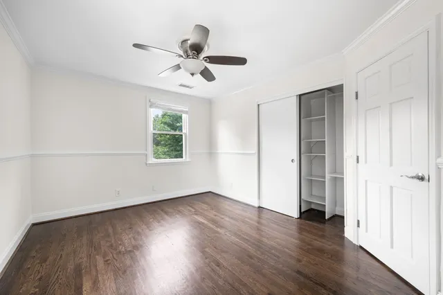 a bathroom with a granite countertop sink a mirror and shower