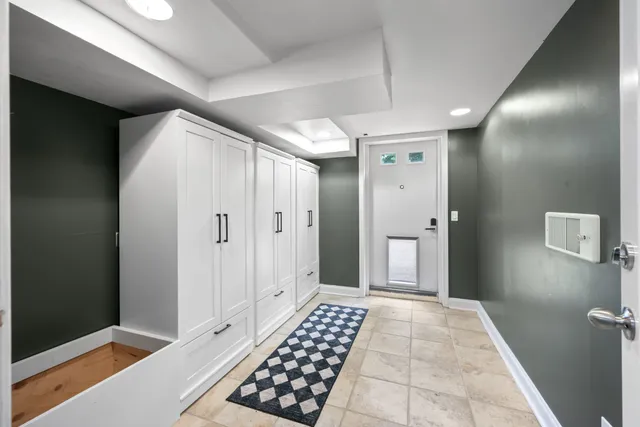 a view of a yard with plants and trees