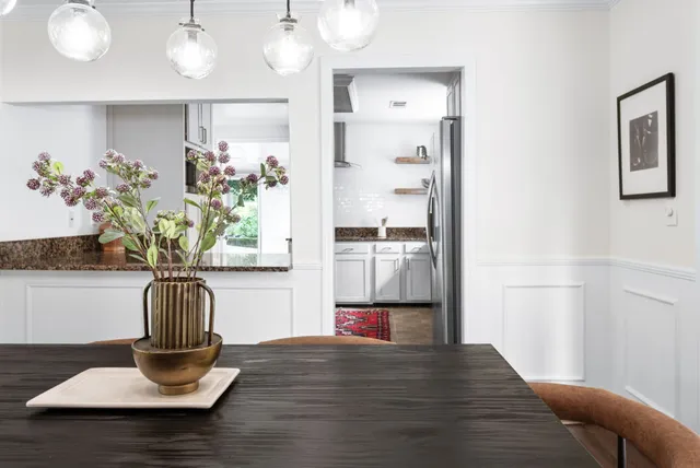 a vase of flowers sitting on a table