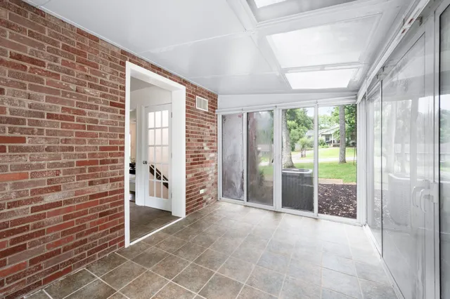 a view of empty room with floor to ceiling window