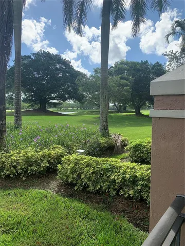 a view of a garden with a fountain