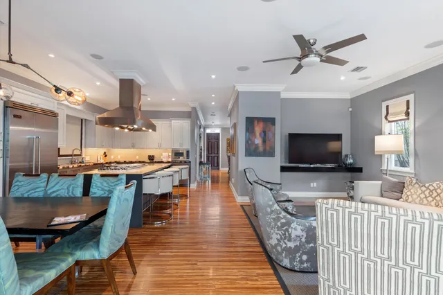 a view of a swimming pool with sitting area and garden