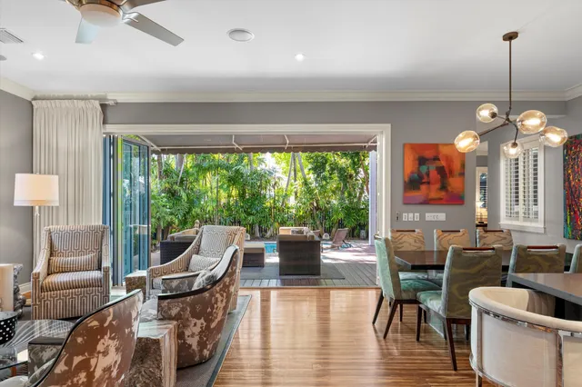 a view of a house with backyard porch and sitting area