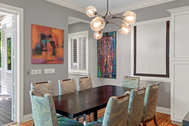 a living room with furniture and large windows