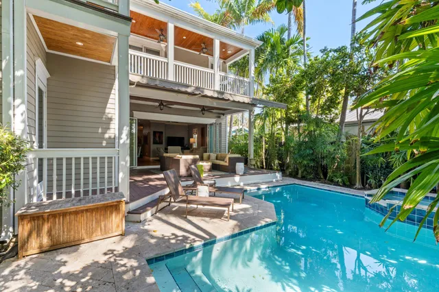 a large kitchen with a table and chairs in it