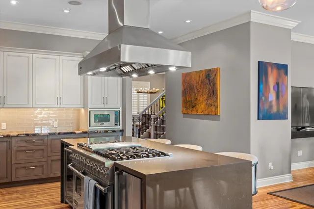 a bathroom with a bathtub and next to a window