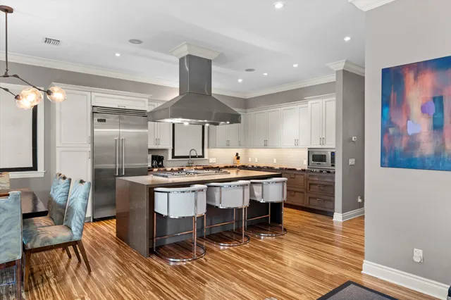 a bathroom with a granite countertop sink toilet a mirror and shower