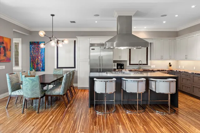 a bedroom with furniture and a large window