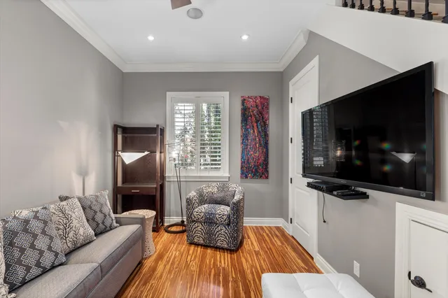 a view of hallway with stairs and wooden floor