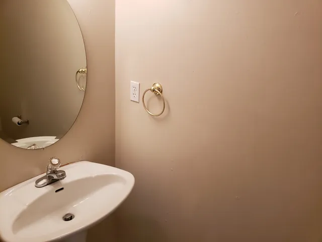 a bathroom with a sink and mirror