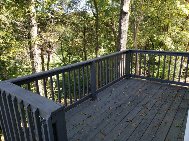 a view of balcony with wooden floor