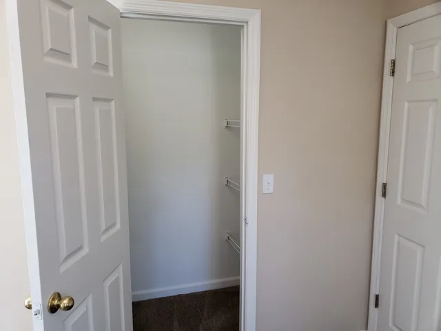 a view of small space with racks on the wall