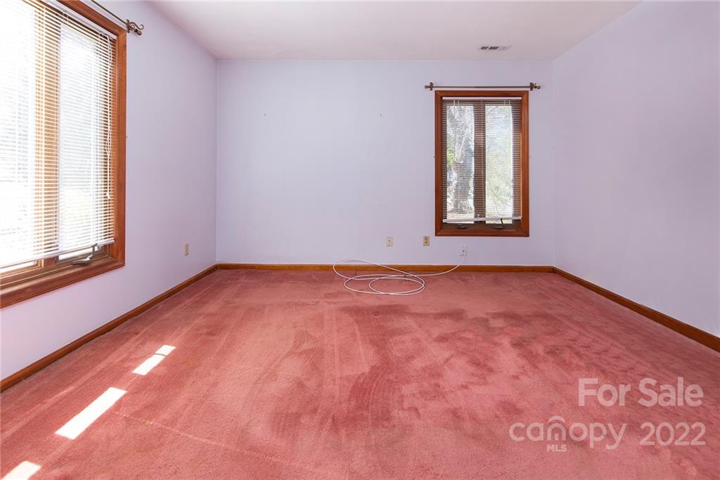 11902 5 Cedars Road Charlotte, NC 28226 - Photo 16 of 24 an empty room with a window