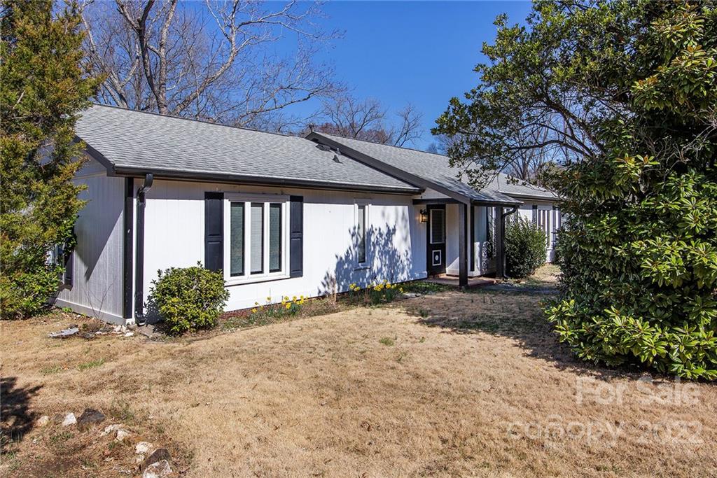 11902 5 Cedars Road Charlotte, NC 28226 - Photo 2 of 24 a front view of a house with garden