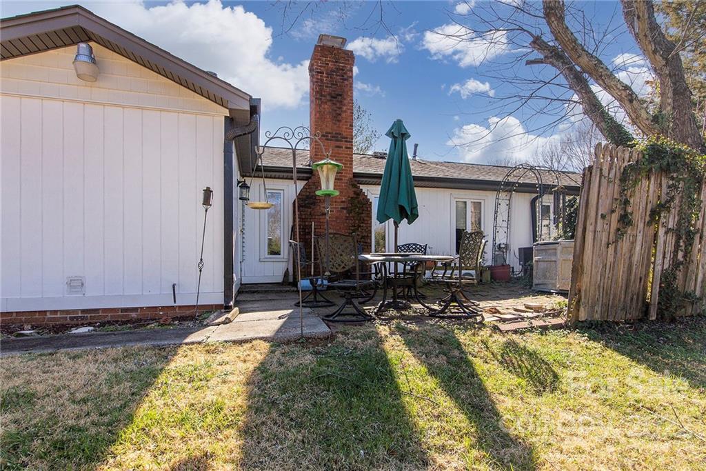11902 5 Cedars Road Charlotte, NC 28226 - Photo 23 of 24 a front view of a house with swimming pool and sitting area