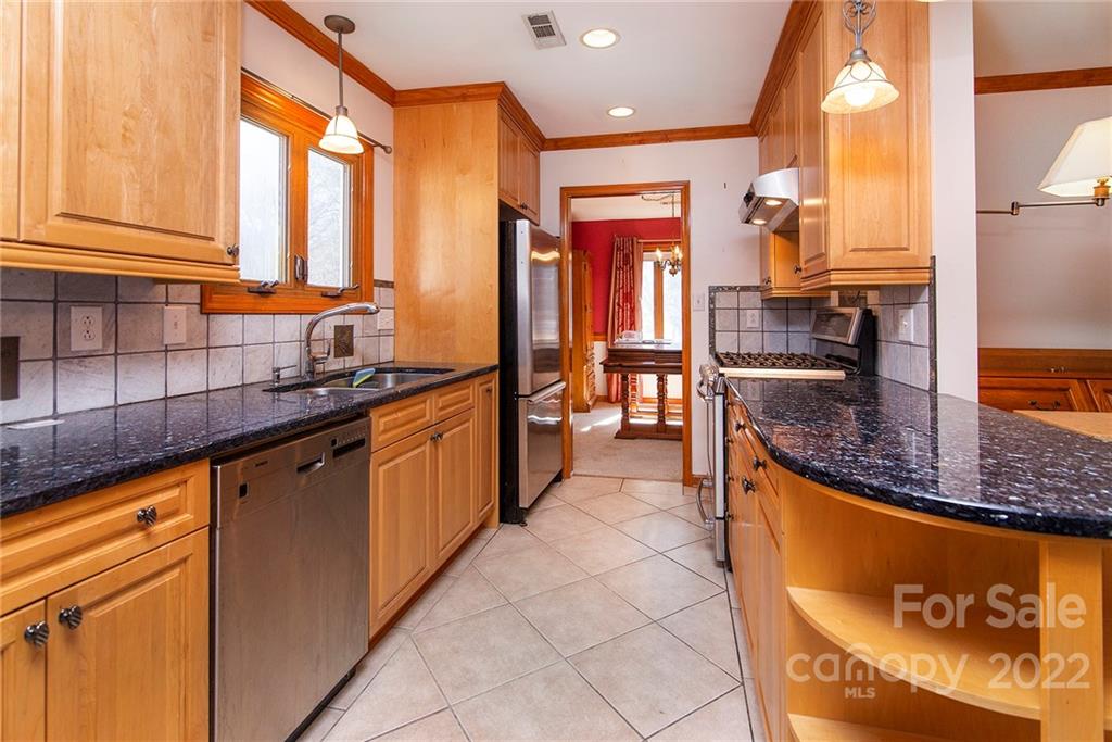 11902 5 Cedars Road Charlotte, NC 28226 - Photo 9 of 24 a kitchen with stainless steel appliances granite countertop a sink and a counter